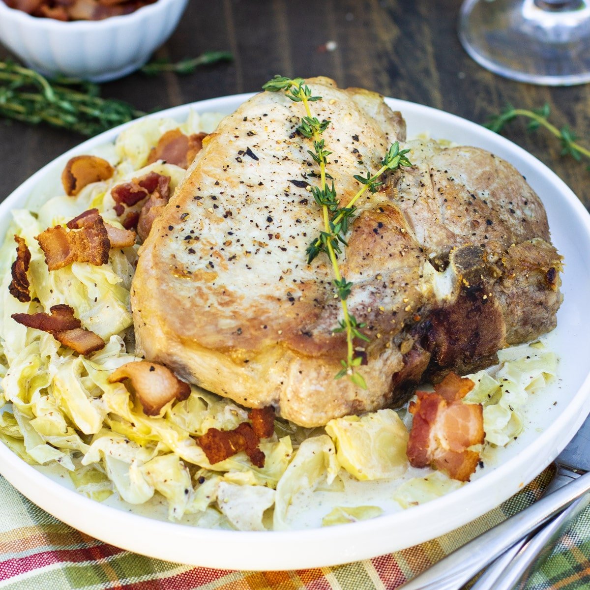 Pork Chops and Creamy Cabbage on a plate.