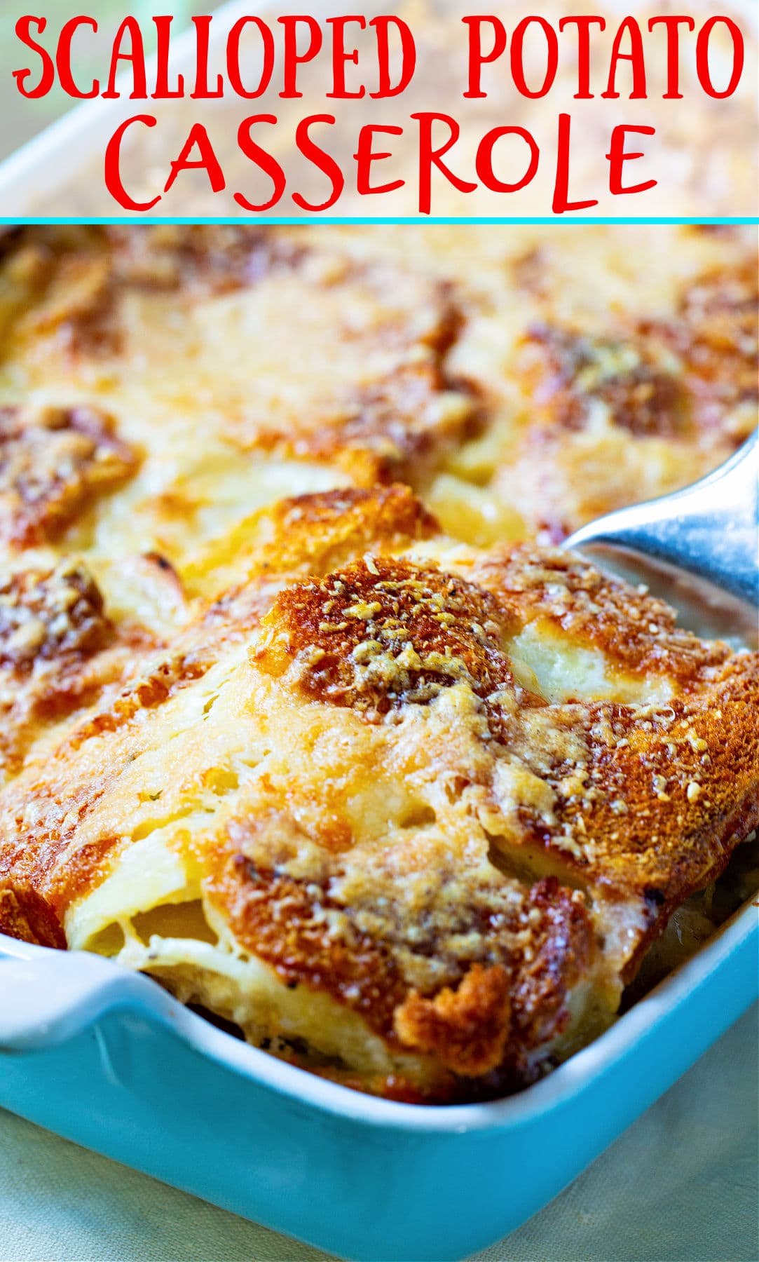 Spatula lifting Scalloped Potato Casserole.