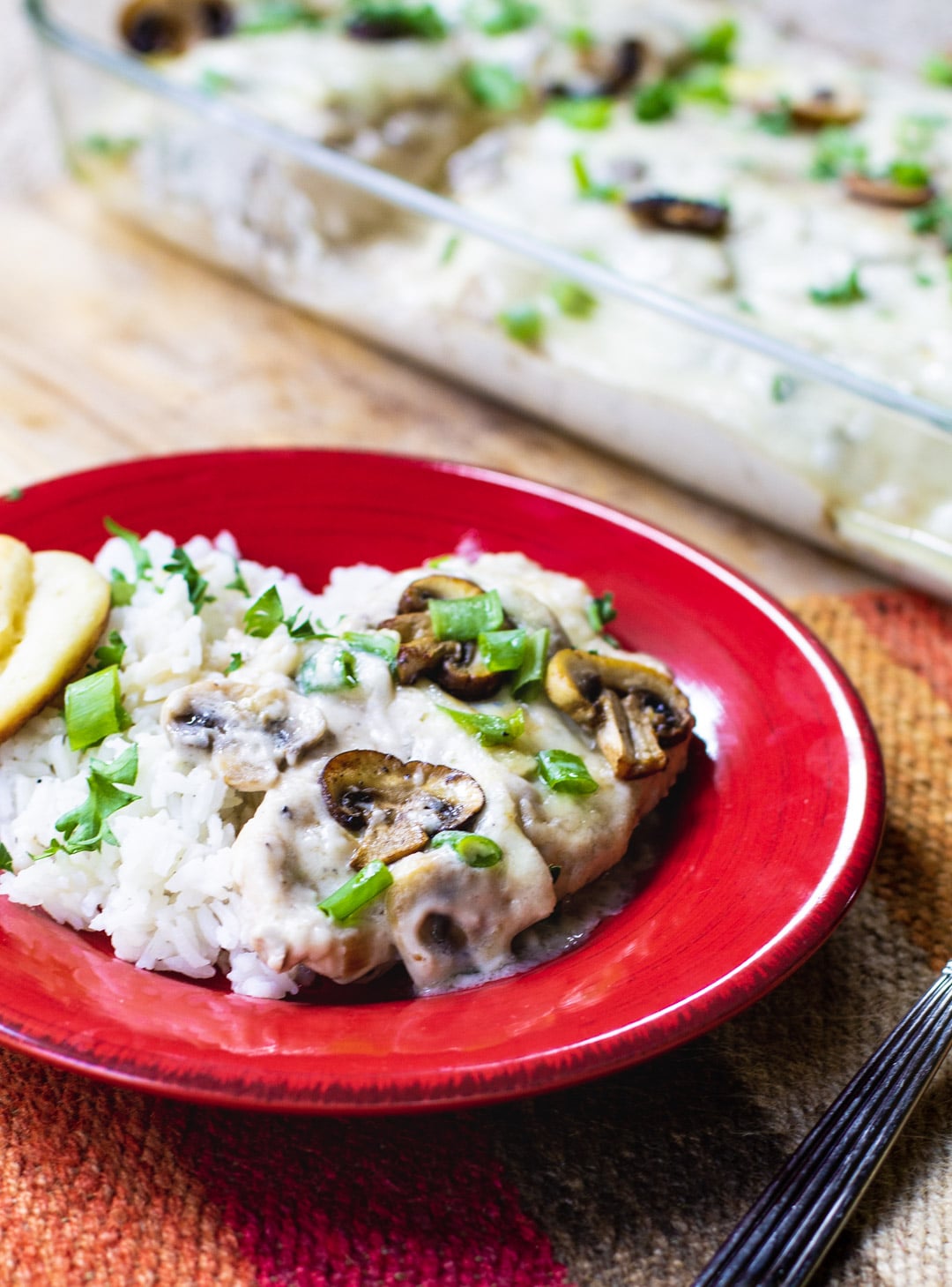 Sherried Chicken with Mushrooms with white rice on a plate.