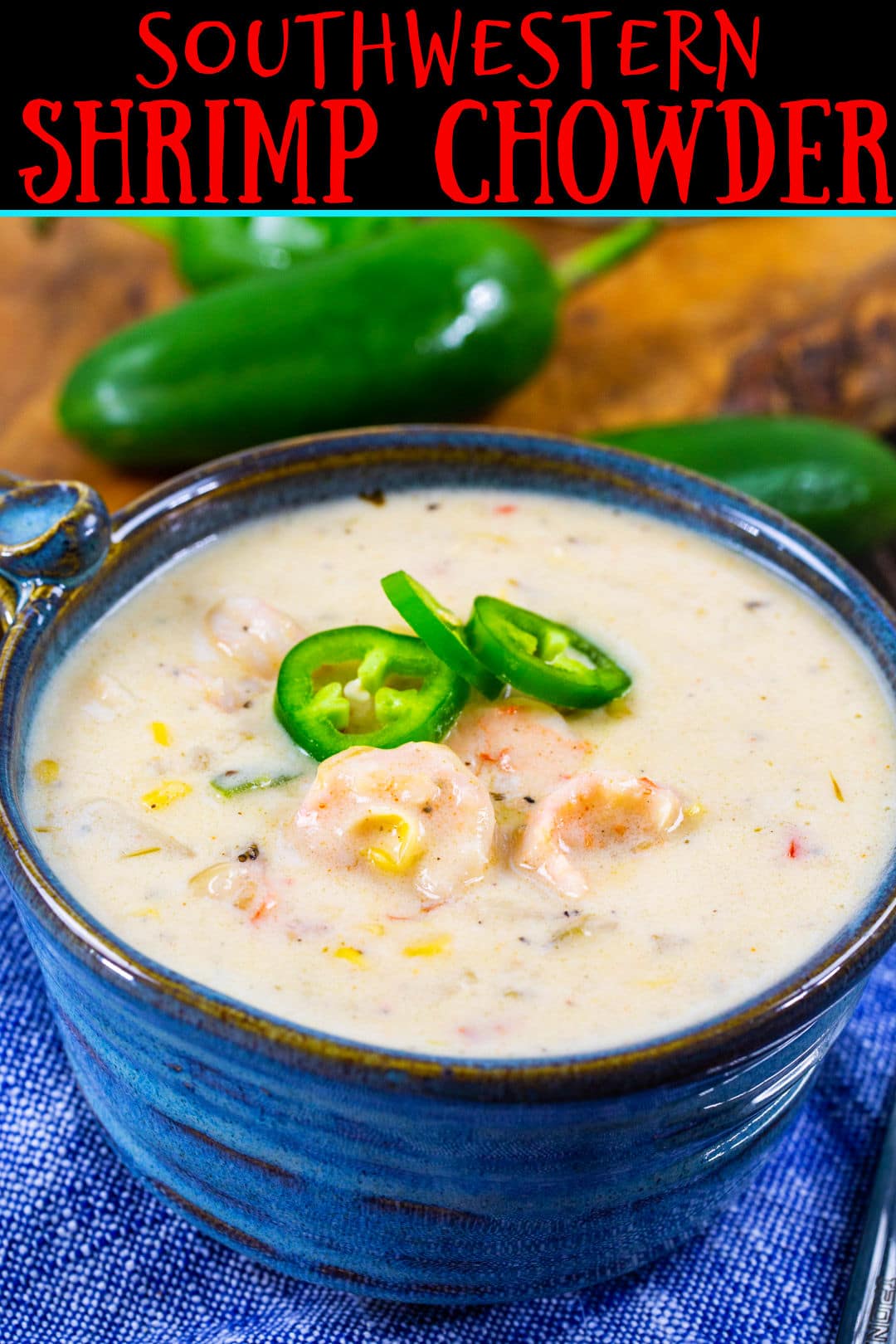 Chowder topped with jalapeno slices  in a blue bowl.