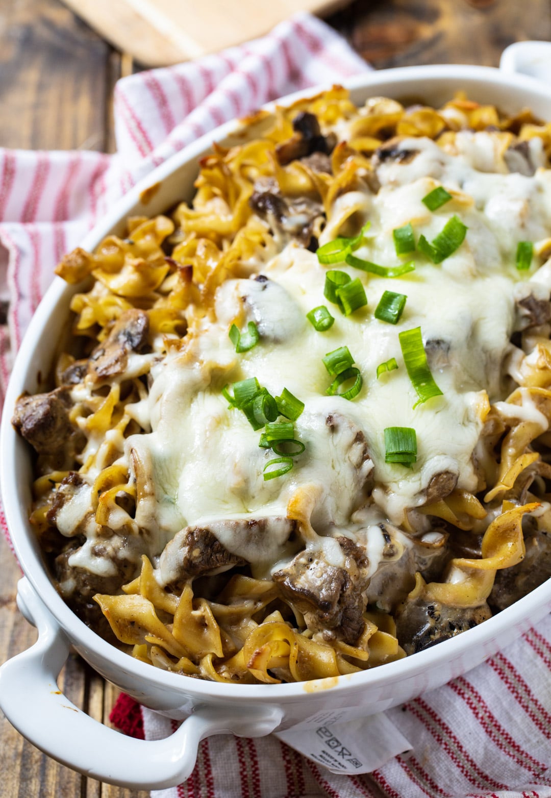 Casserole topped with cheese in baking dish.