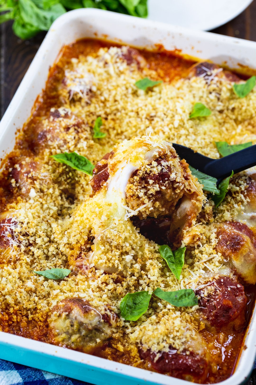 Chicken Parmesan Meatballs in a baking dish.