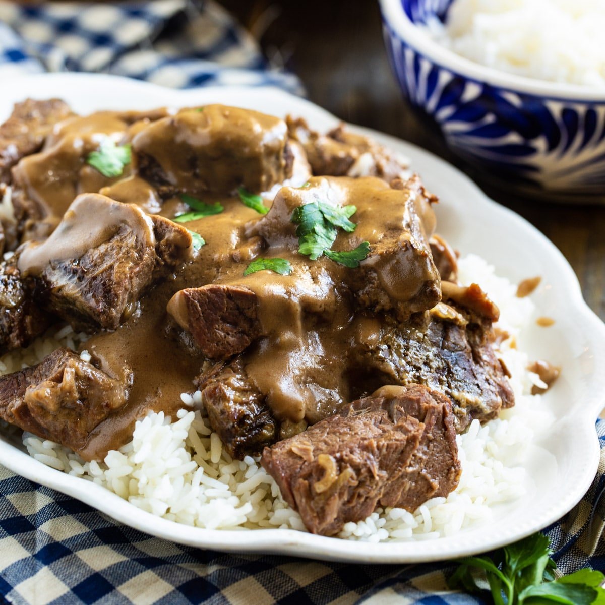 Crock Pot Beef Tips with Gravy over white rice.