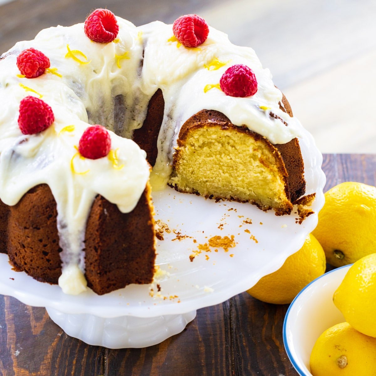 Lemon Cream Cheese Pound Cake on a cake stand.