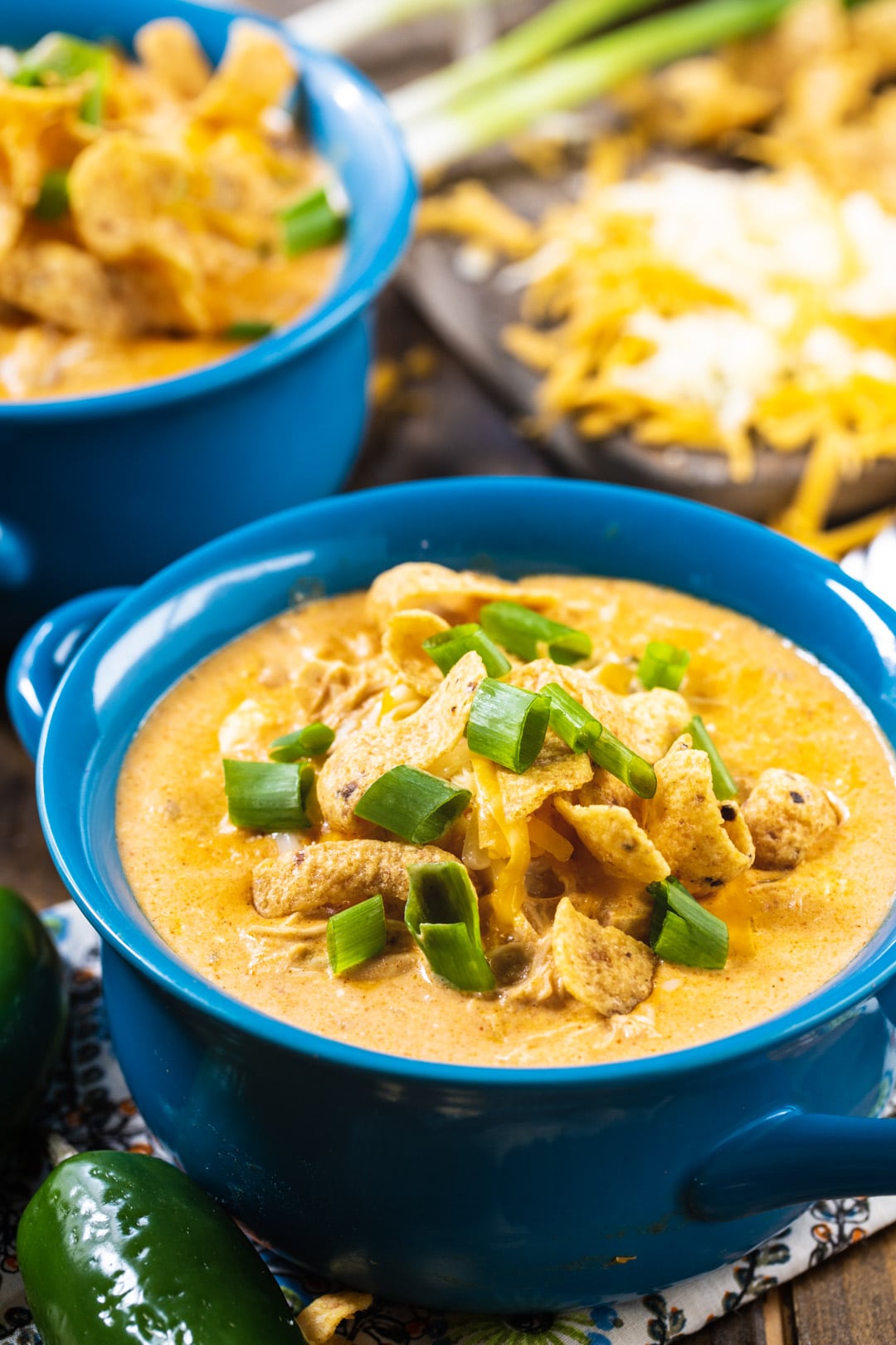 Close-up of Slow Cooker White Chicken Chili in blue soup bowl.