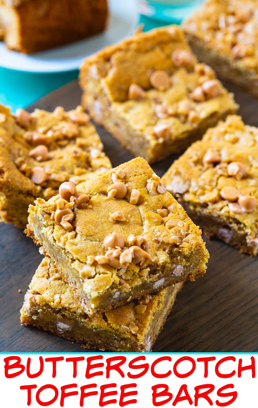 Butterscotch Toffee Blondies arranged on wood cutting board.