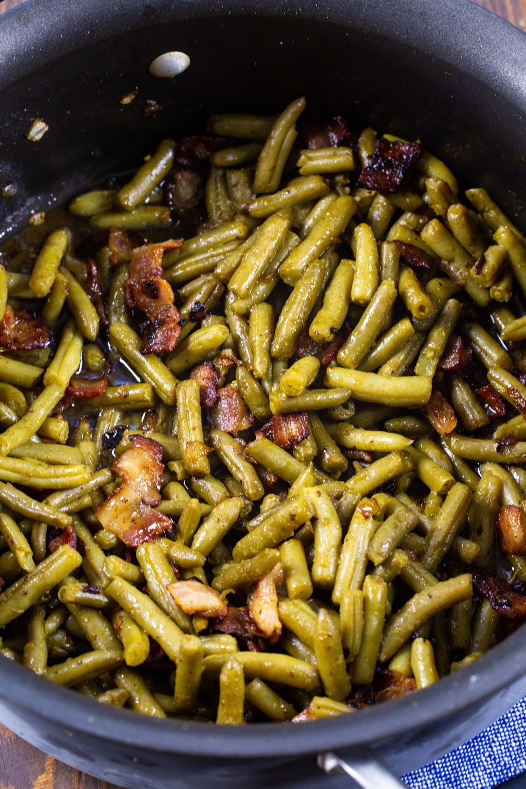 Cooked green beans in a large pot.