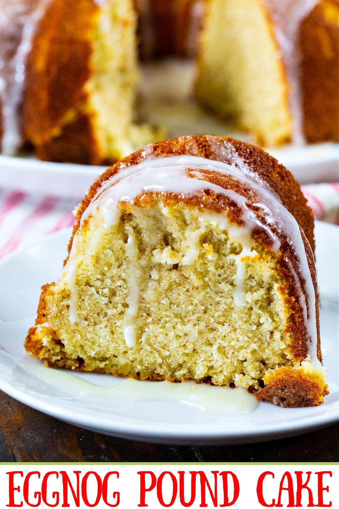 Slice of Eggnog Pound Cake with glaze dripping down.