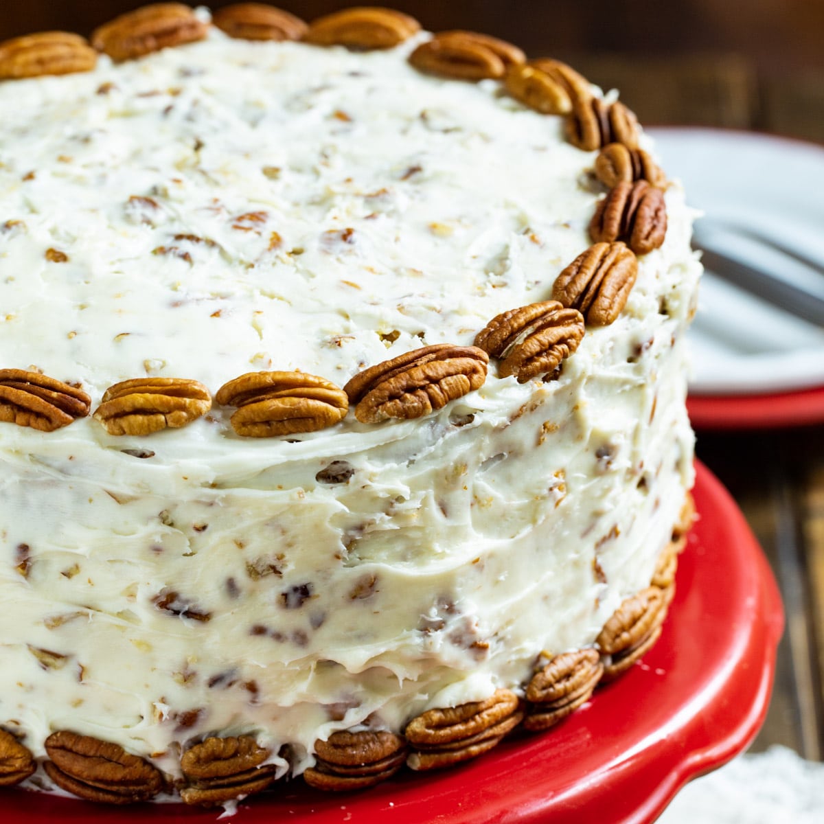 Italian Cream Cake on a red cake stand.