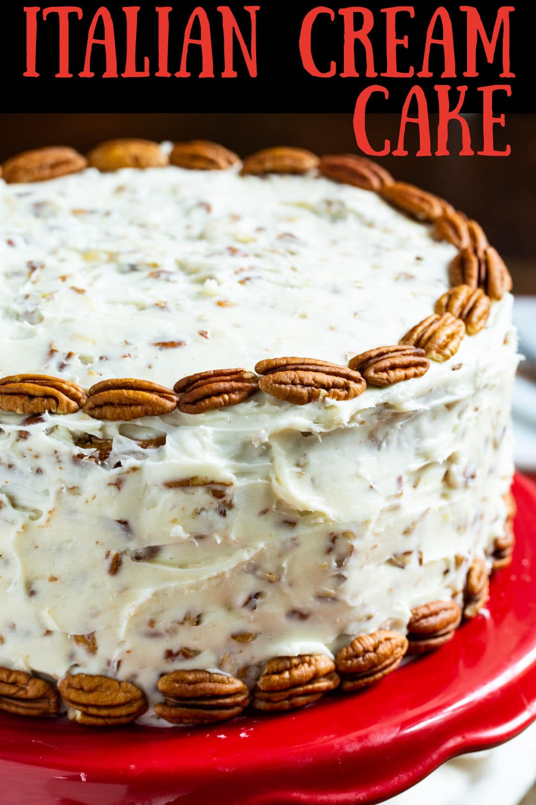 Italian Cream Layer Cake on red cake stand.