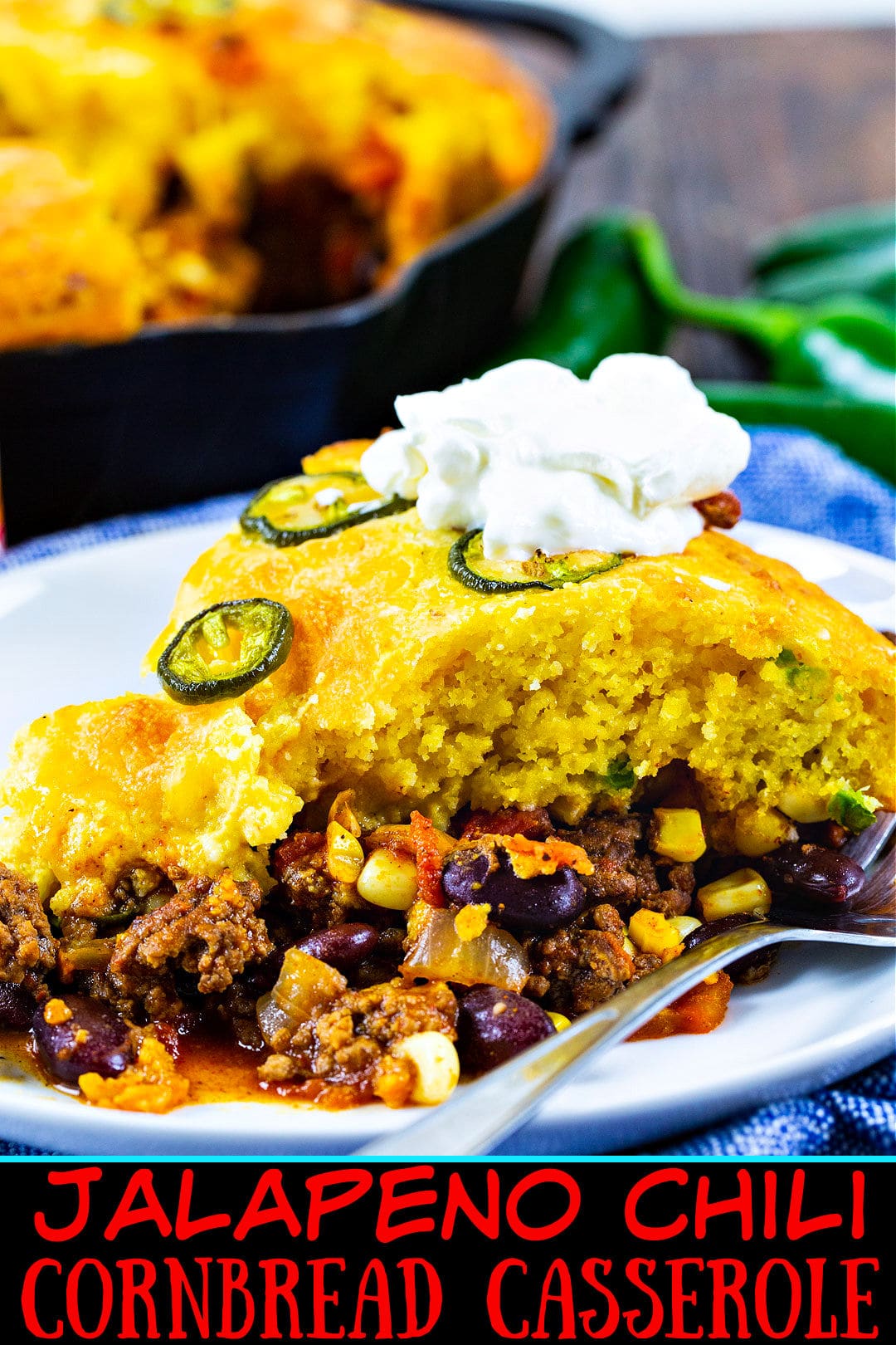 Jalapeno Chili Cornbread Casserole topped with sour cream.