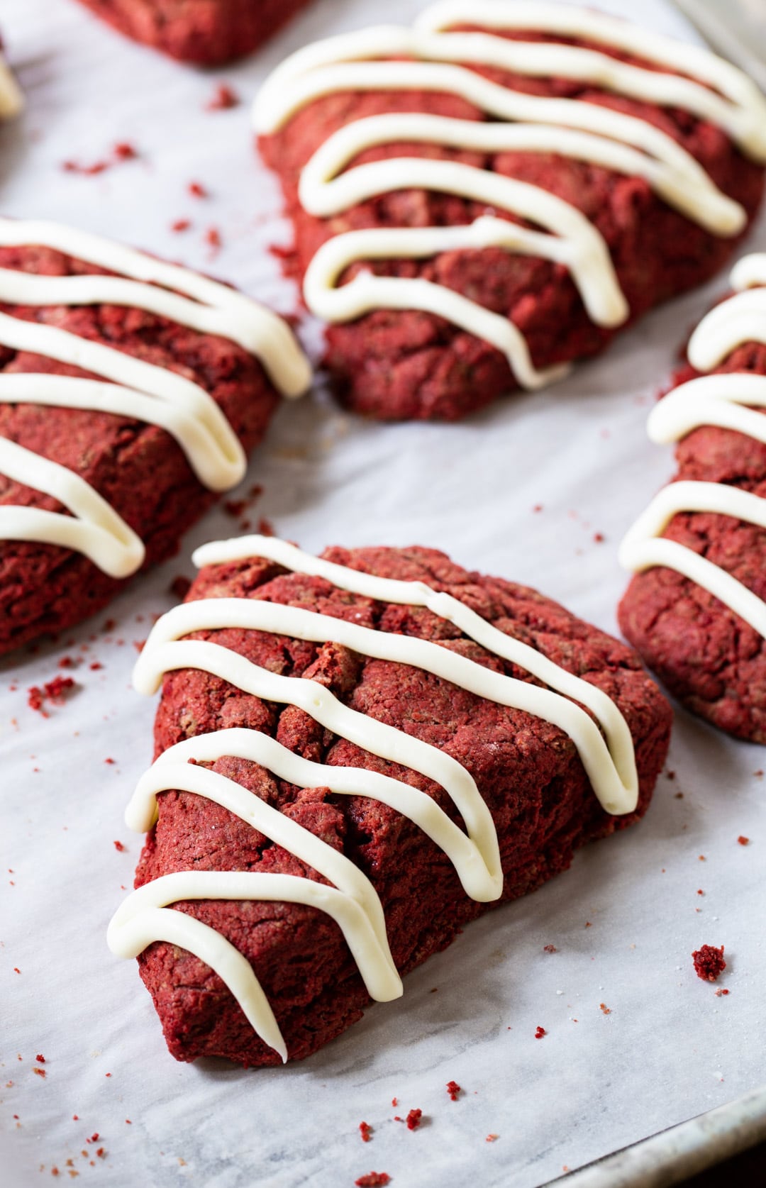 Red Velvet Scone drizzled with cream cheese glaze.