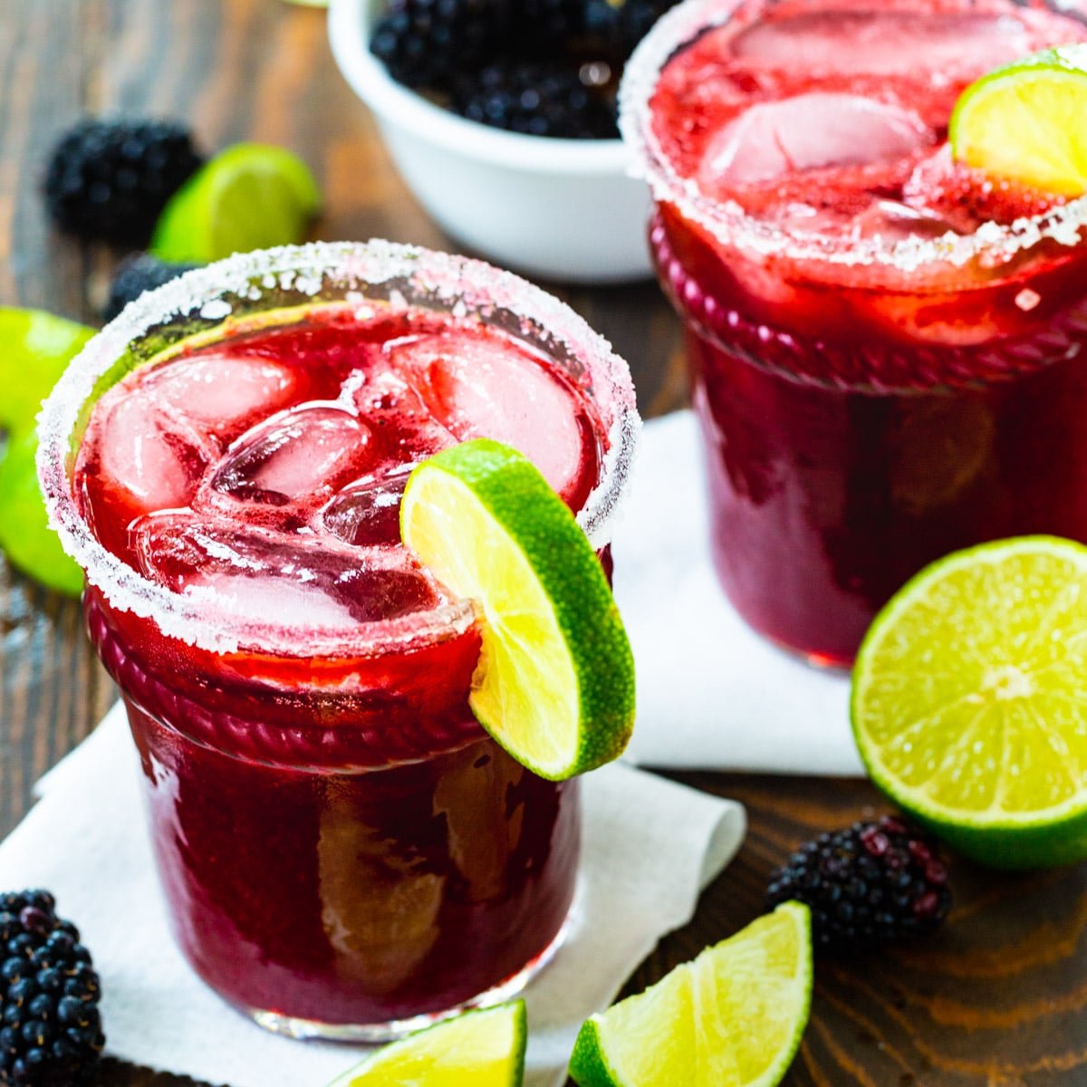 Blackberry Margaritas in two glasses.