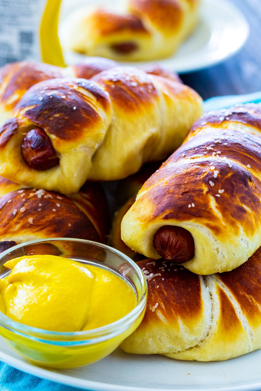 Pretzel Dogs piled on a plate.
