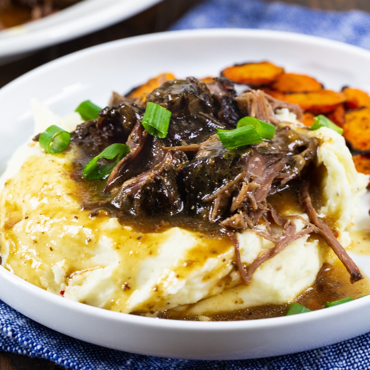 Slow Cooker 3-Packet Pot Roast over mashed potatoes.