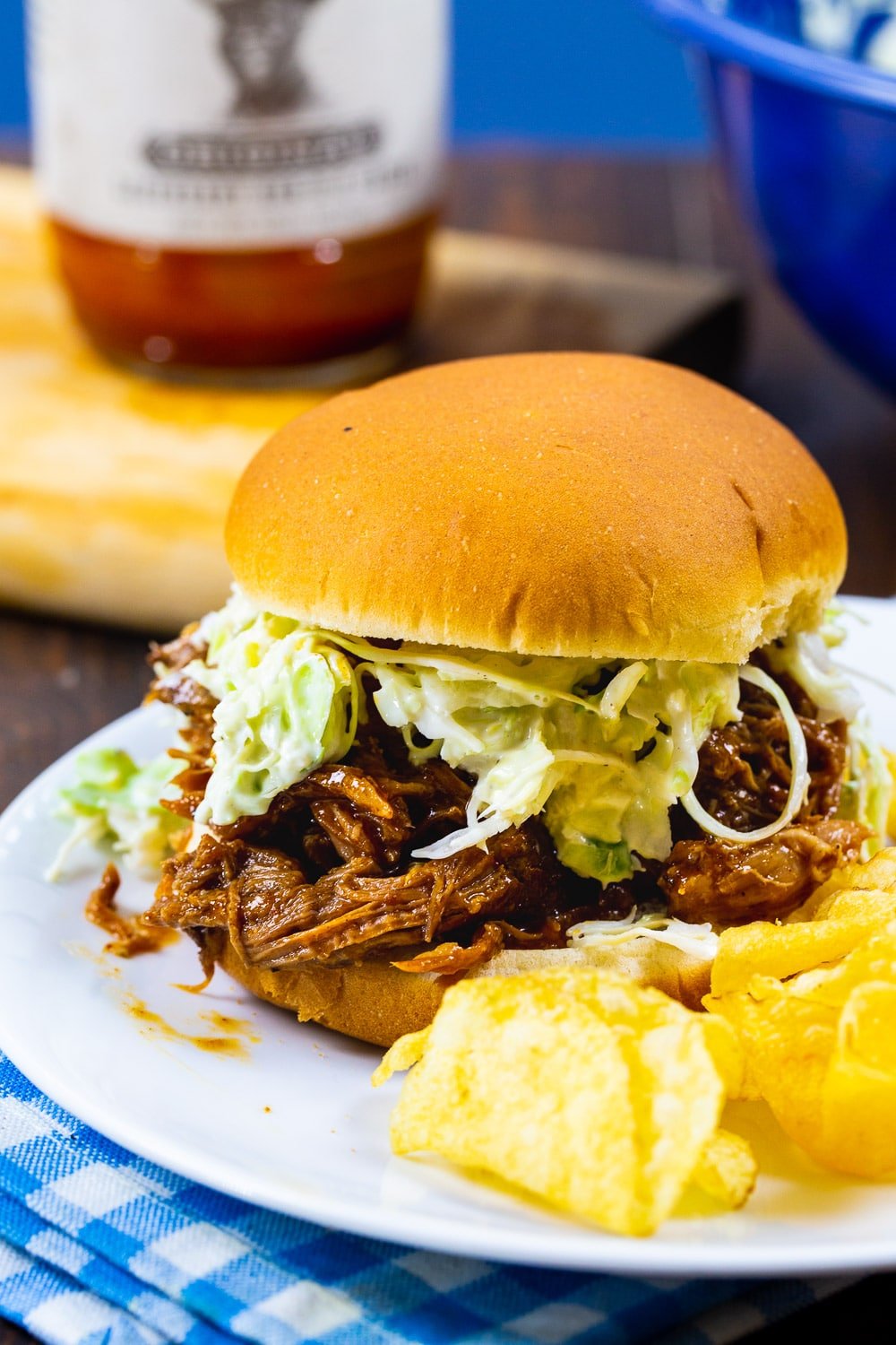 Smokey Pulled Pork on a bun with coleslaw.