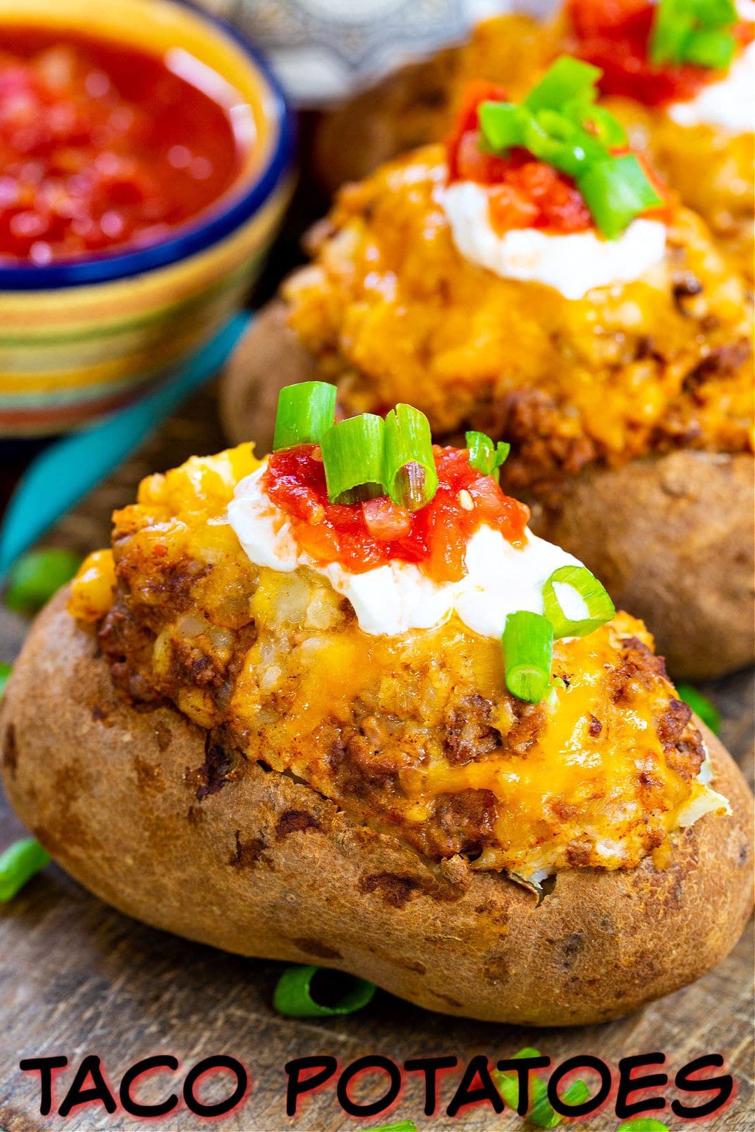 Double Stuffed Taco Potatoes on a wood cutting board.