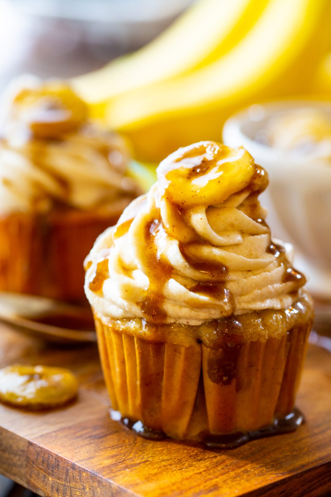 Bananas Foster Cupcakes with praline sauce dripping down.