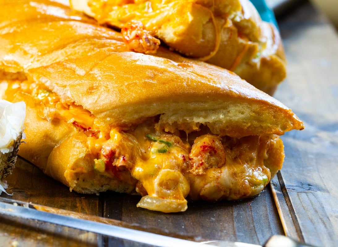 Filling oozing out of stuffed crawfish bread.