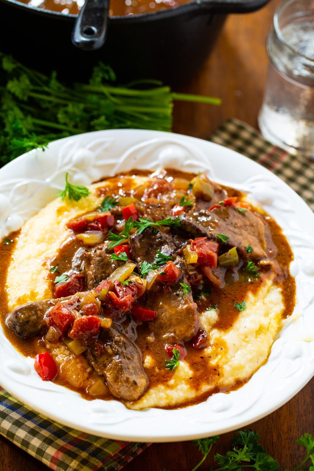 Grillades and Grits dished up in a bowl.