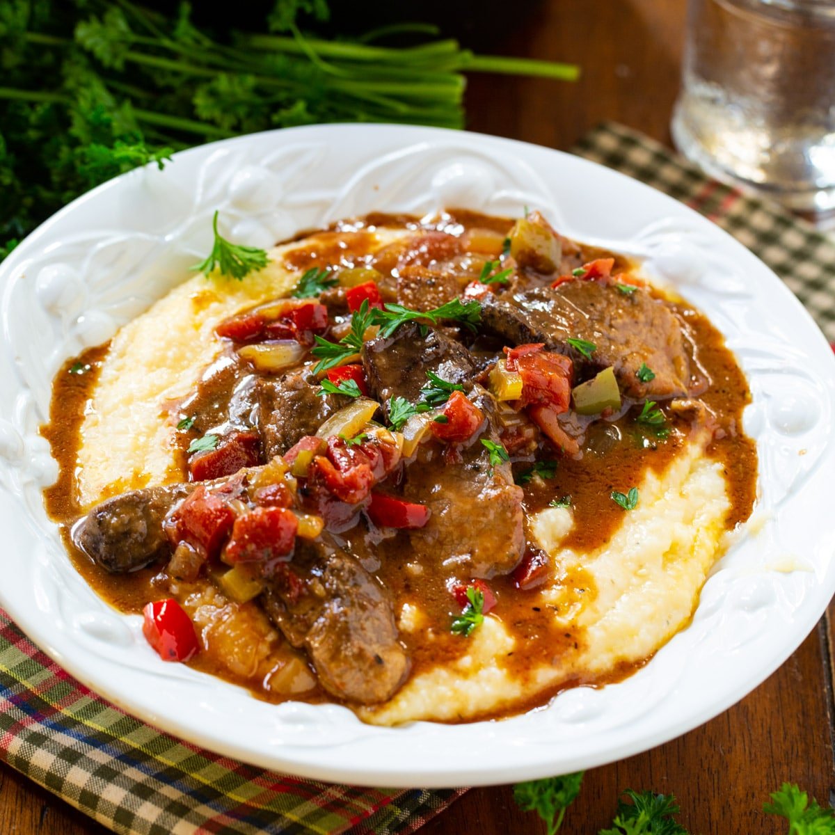 Grillades and Grits dished up in a pasta bowl.