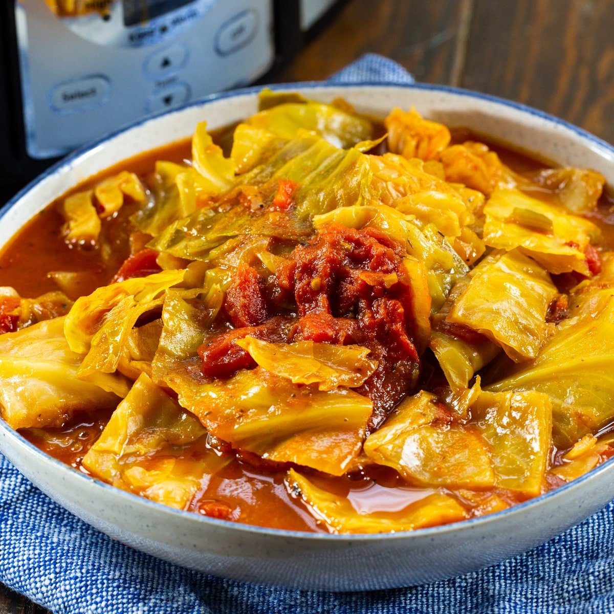 Slow Cooker Cabbage and Stewed Tomatoes in a serving bowl.