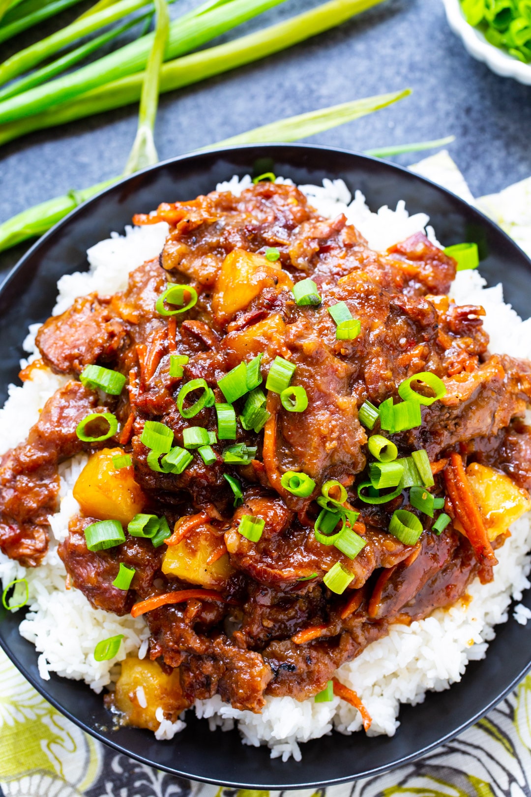 Slow Cooker Spicy Mongolian Beef with Pineapple served over white rice.