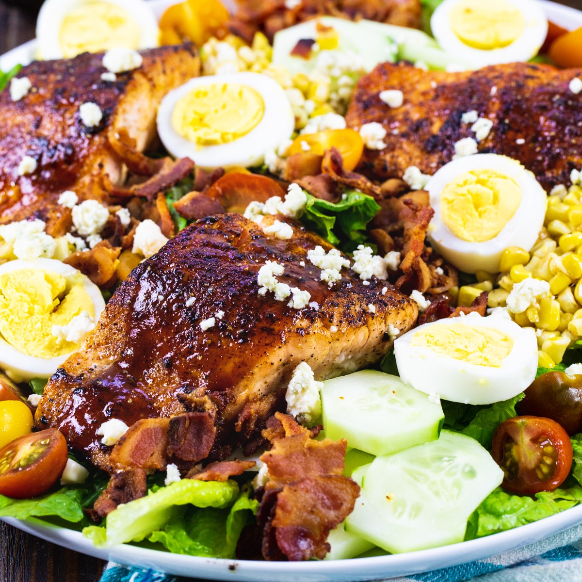 BBQ Salmon Cobb Salad on a large plate.