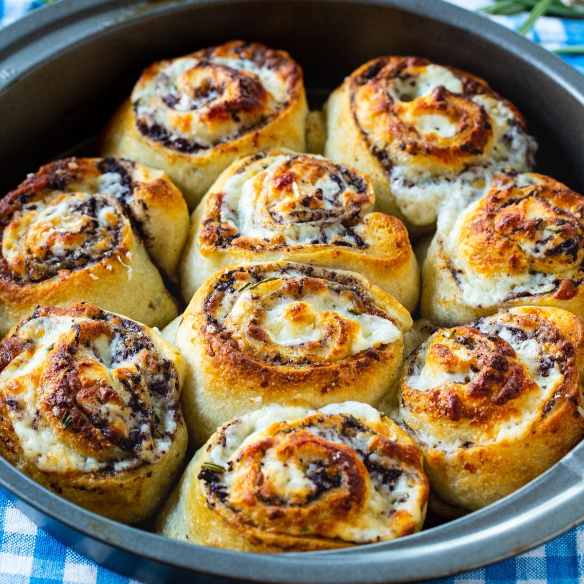 Easy Olive Cheese Rolls in a cake pan.