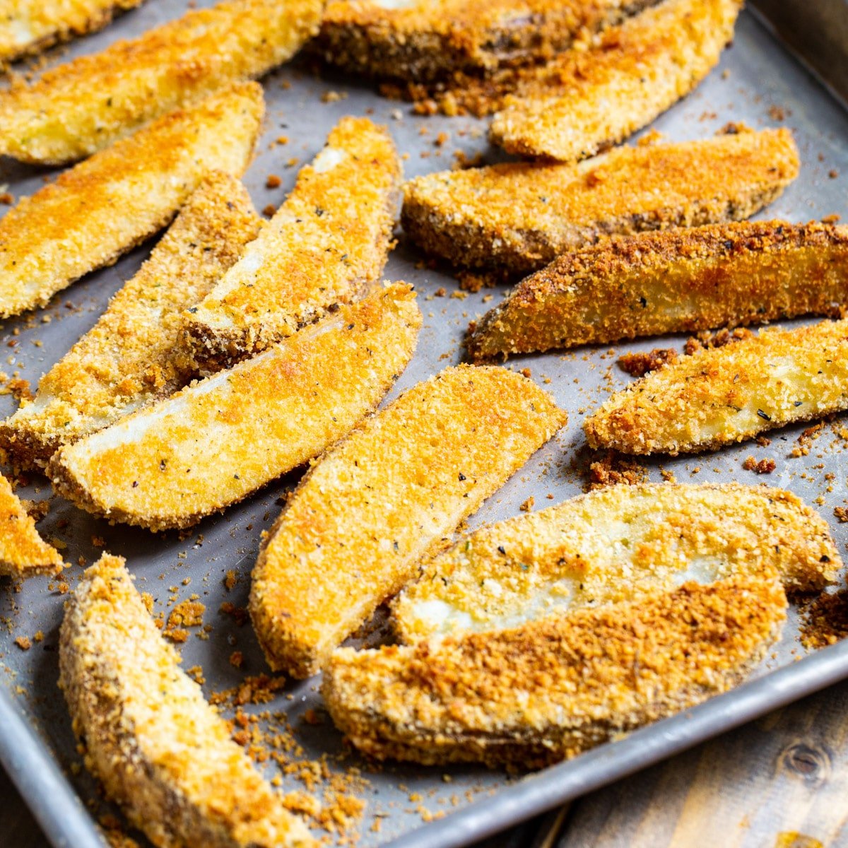 Parmesan Crusted Ranch Potato Wedges on a baking sheet.