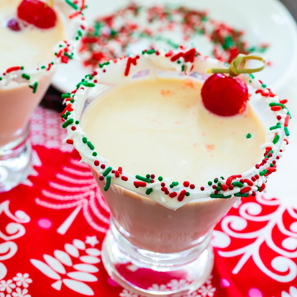 Sugar Cookie Martini in glass with sprinkles on rim.