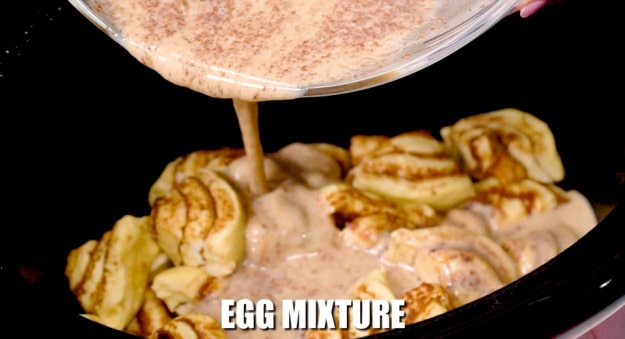 Pouring egg mixture into slow cooker.