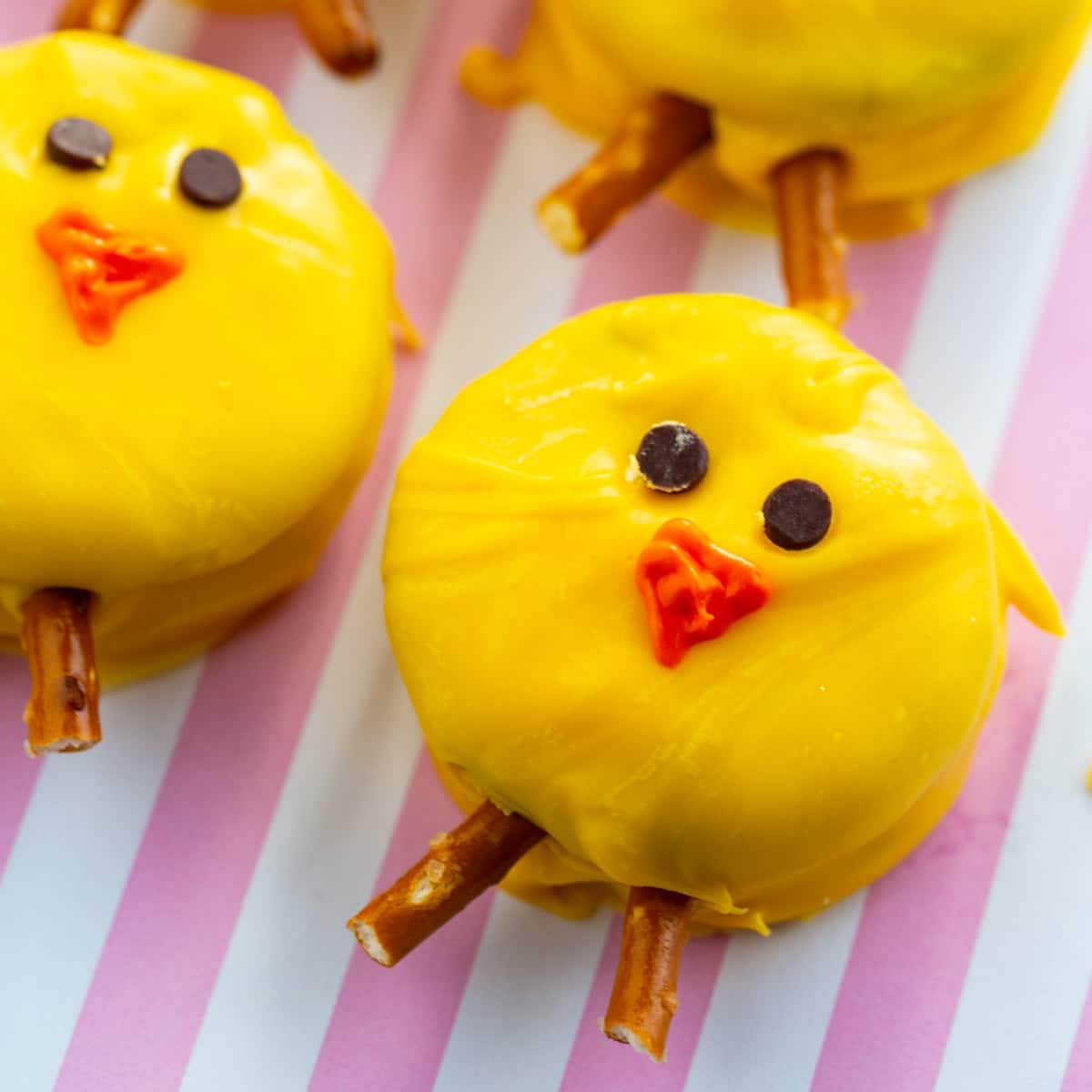 Oreo Easter Chicks on a pink and white striped background.