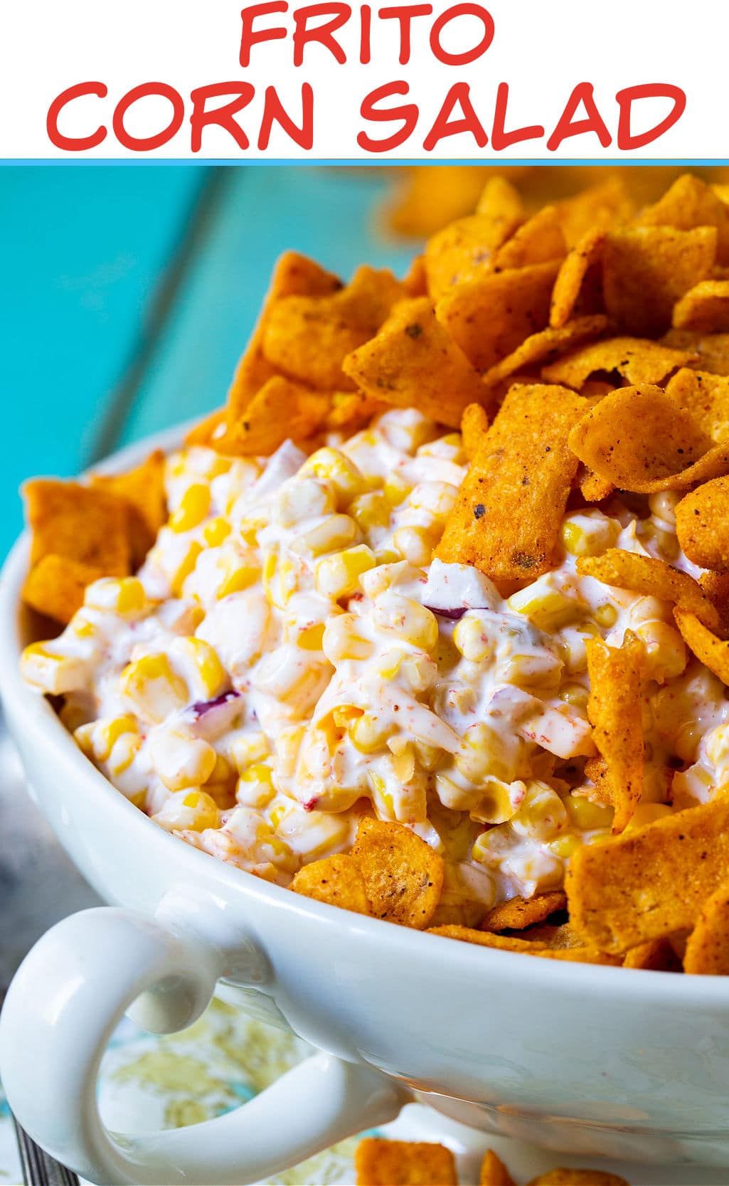 Corn Salad topped with frito chips in a serving bowl.
