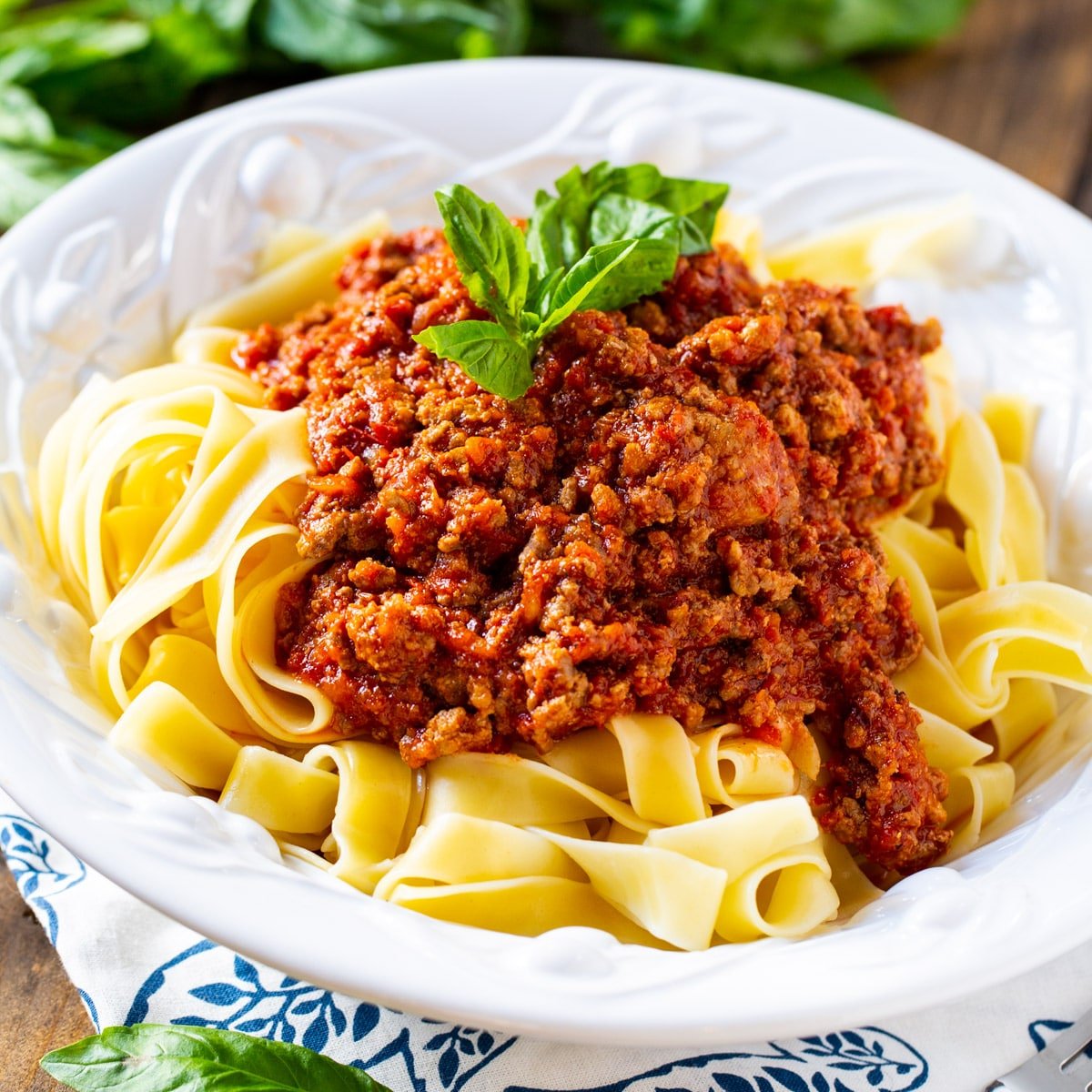 Bolognese Sauce over pasta in a bowl.