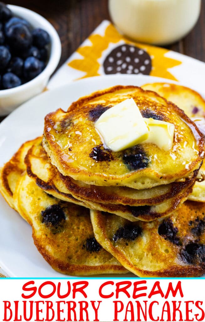 Stack of Sour Cream Blueberry Pancakes on a plate.
