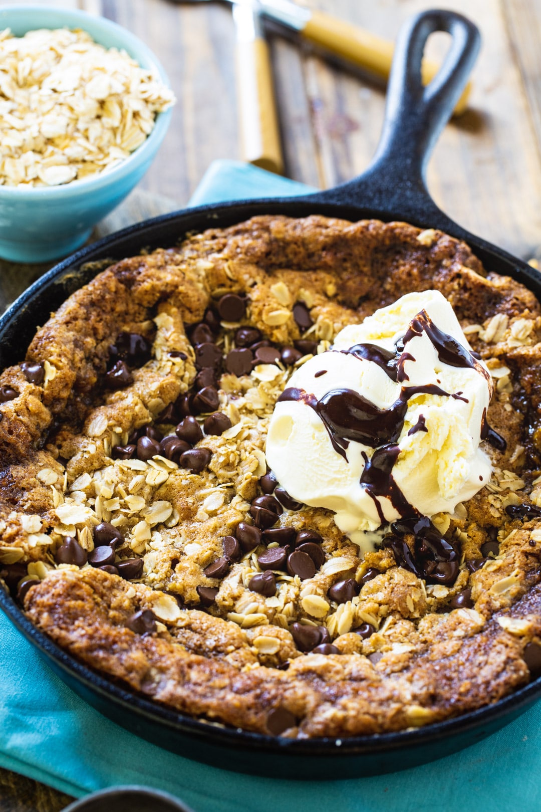 Skillet Cookies topped with vanilla ice cream.