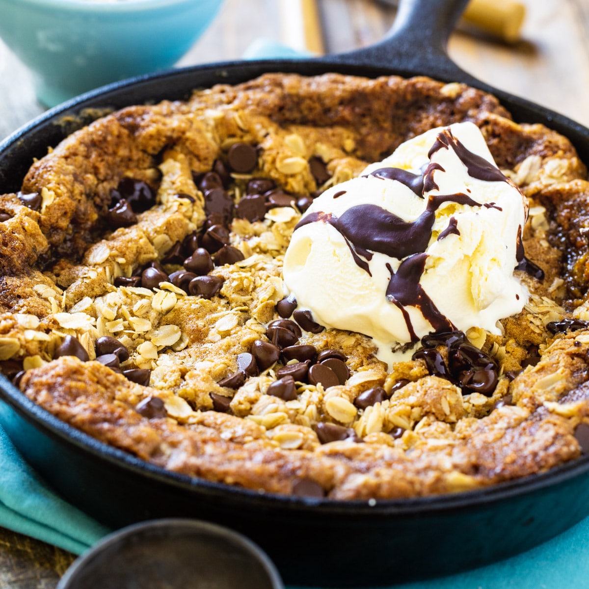 Chocolate Chip-Peanut Butter Oatmeal Skillet Cookie in a cast iron pan.