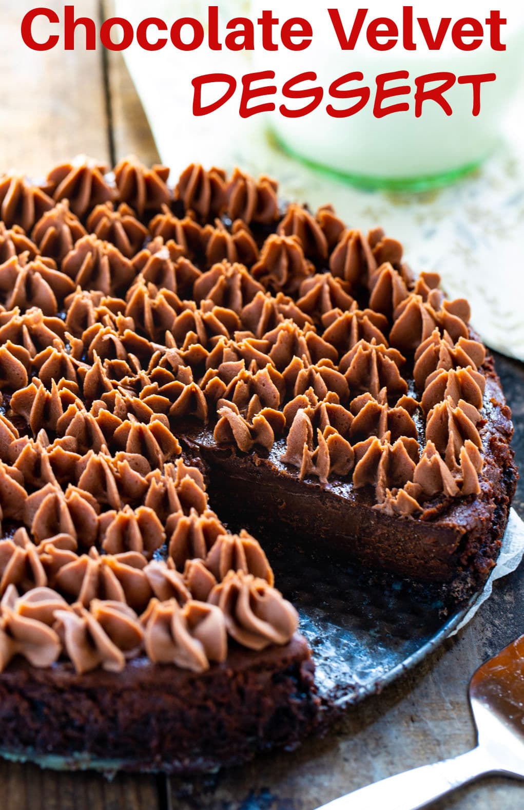 Chocolate Velvet Dessert with a slice cut out.