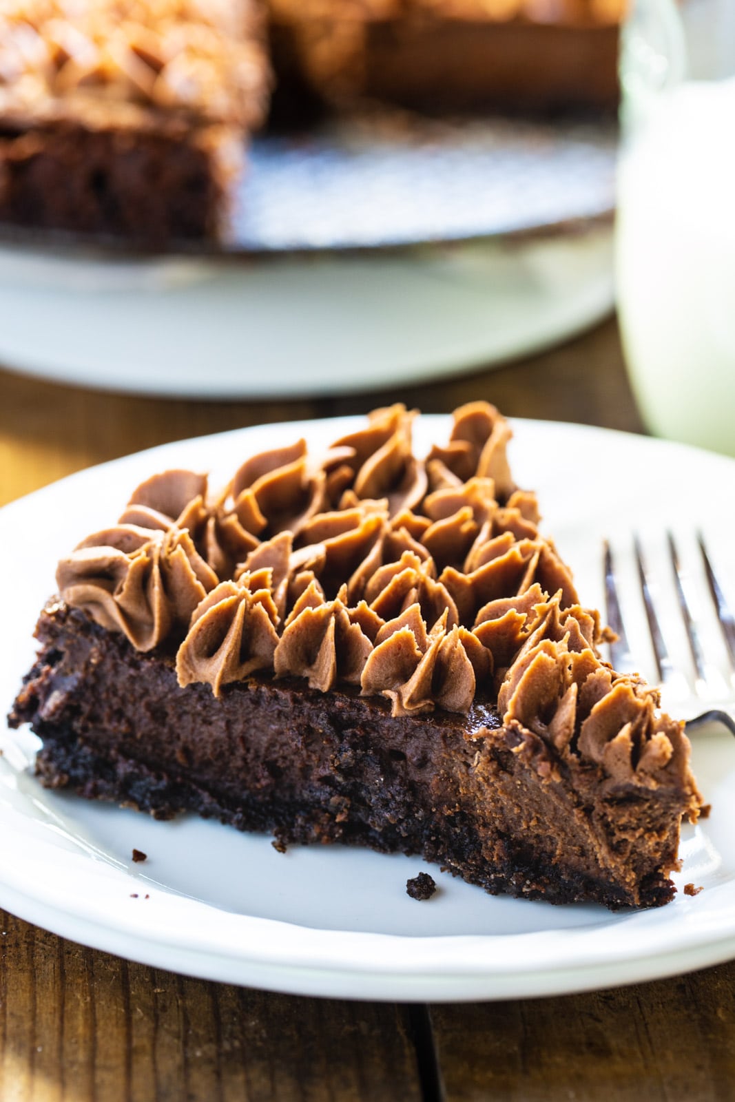 Slice of chocolate tart on a plate.