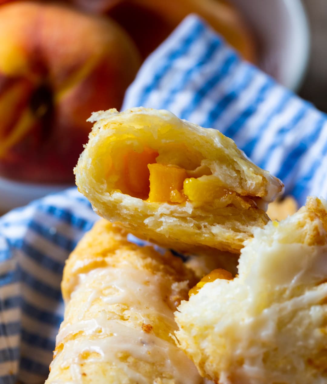 Fried Peach pie cut in half to show inside.