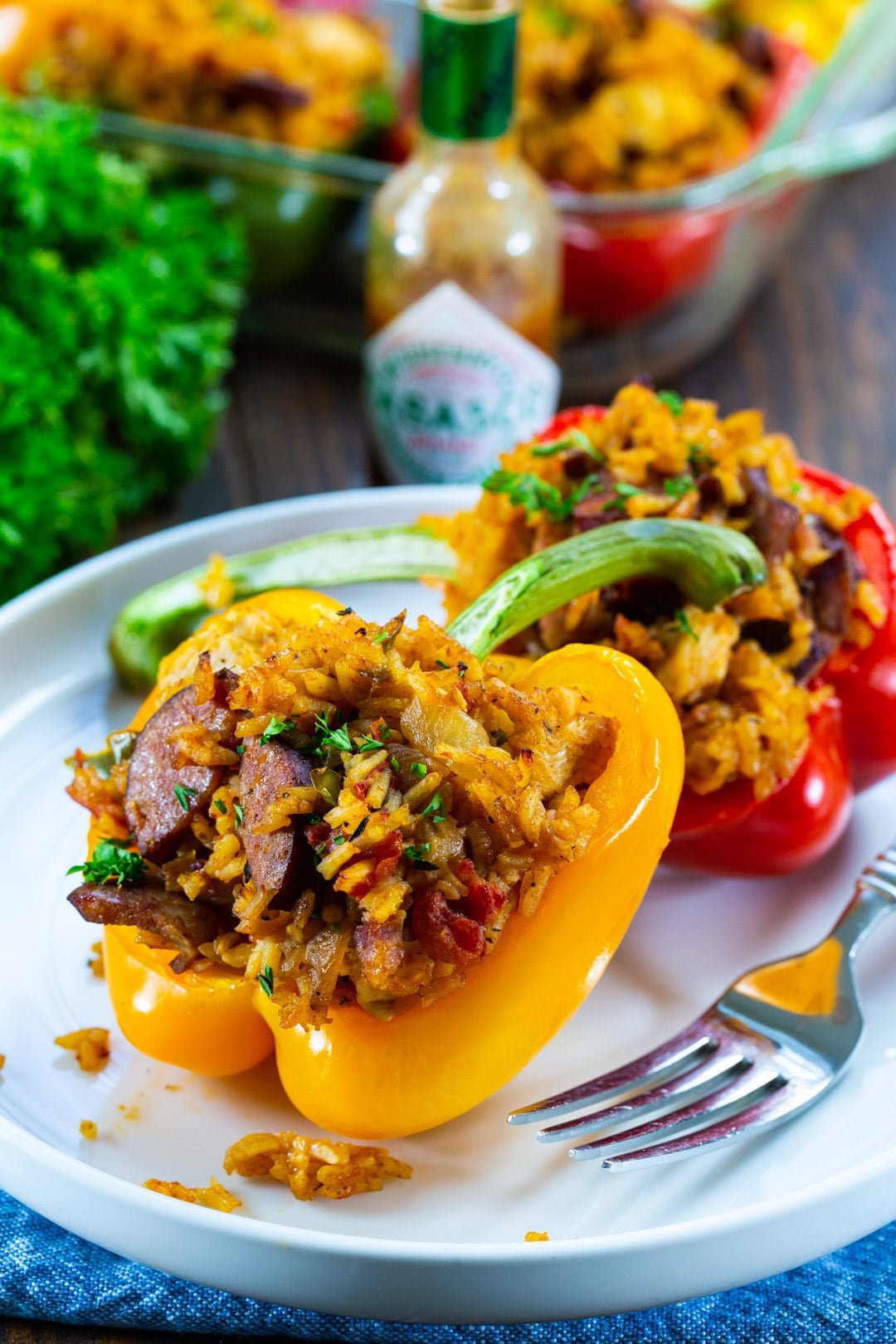 Two stuffed peppers on a plate.