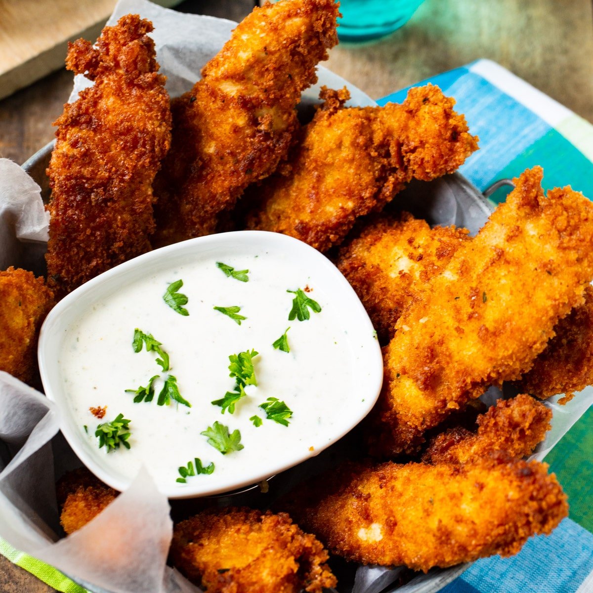 Ranch Chicken Fingers with bowl of ranch dressing.