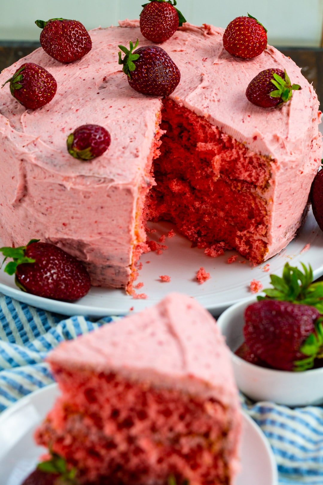 Strawberry Layer Cake with a slice removed.