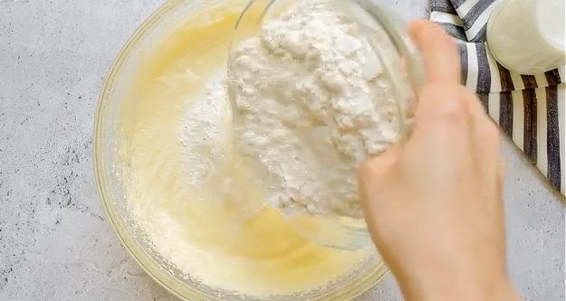 Adding flour.