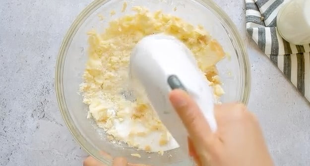 Beating butter and sugar.