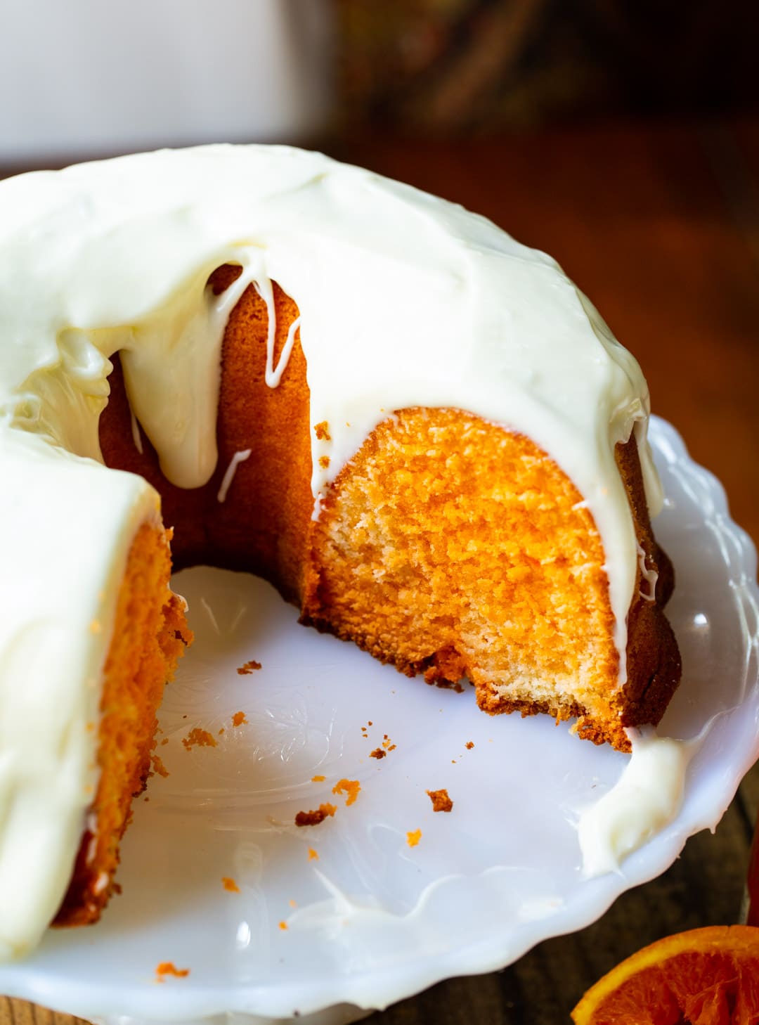 Fanta Pound Cake with Cream Cheese Frosting on a cake stand.