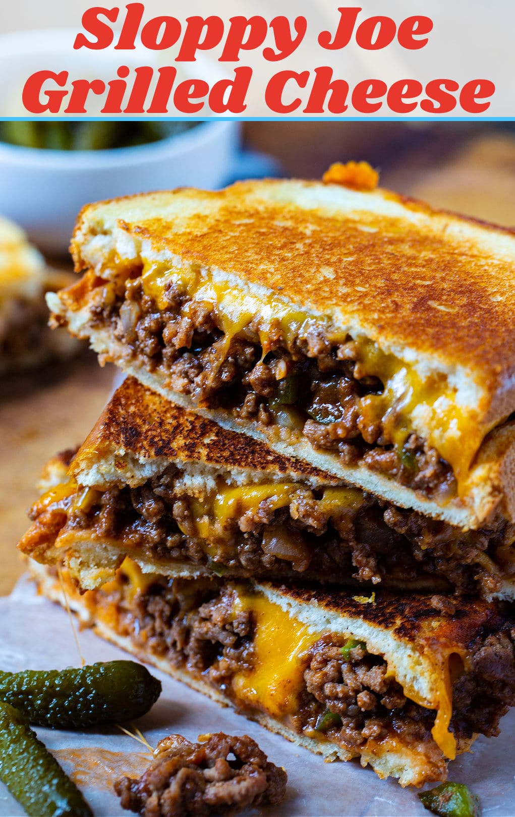 Sloppy Joe Grilled Cheese halves stacked on top of each other.