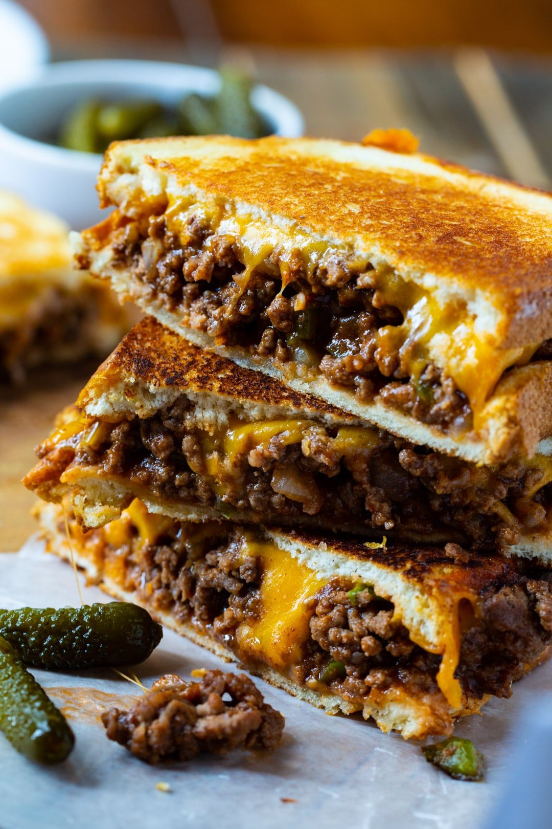 Grilled cheese halves stacked on top of each other.