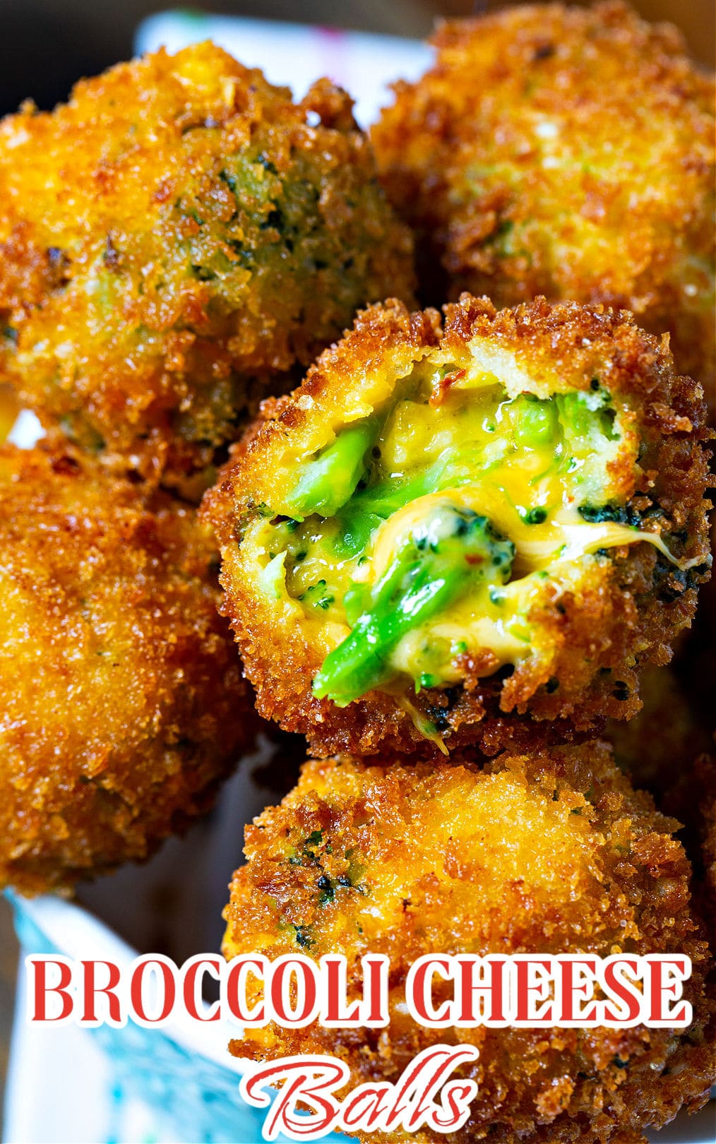 Fried Broccoli Cheese Balls. One has a bite bitten out showing inside.